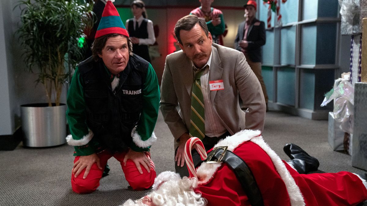 (L to R) Jason Bateman as self, Will Arnett as Terry Seattle, kneeling over Santa